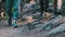 View of Legs of Group Tourists Climbing Up Along Stone Trail in Mountain Forest