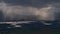 View of Leknes town on VestvÃ¥gÃ¸y, Lofoten, Norway in unsettled weather conditions with clouds, strong rain and sunshine.