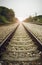 View of the length of railway with green tree at left and right side of railway,filtered image, light effect and flare added