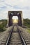 View of the length of railway and old steel bridge,filtered image,light effect ,There light at the end of the tunnel,s