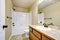 View of light tones bathroom with modern vanity cabinet.