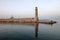 View of the lighthouse in the Old Venetian Harbor  of Rethymnon. Crete, Greece