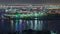 View of lights from illuminated modern city Dubai at night, UAE aerial timelapse