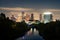 View of the lights of night Houston from the bridge over the Buffalo Bayou River. Reflections of buildings in the water