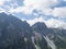 View on limestone moutain peaks, Alpine landscape of Stubai Tirol Alps, Austria. Summer blue sky, white clouds