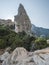 A view of limestone rock pillar Aguglia at Cala Goloritze beach at Gulf of Orosei. Famous travel destination. Sardinia