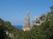 A view of limestone rock pillar Aguglia at Cala Goloritze beach at Gulf of Orosei. Famous travel destination. Sardinia