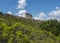 View of limestone tower Perda Liana, impressive rock formation on green forest hill, sardinian table mountain. National