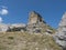 View of limestone tower Perda Liana, impressive rock formation on green forest hill, sardinian table mountain. National