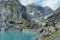 View of the Limmernsee dam in the canton of Glarus. Hiking high above the mountain lake in the Alps. Glarus, Switzerland