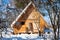 View of little timber chalet and wide skis