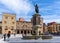 View of the lively and busy Plazuela de Marquez square with the statue of Don Pelayo