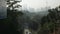 view local street leads into the downtown city center of Kuala lumpur in Malaysia with sunrise in the sky