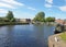 a view of the lock entrance to brighouse basin with moored houseboats on the calder and hebble navigation canal in calderdale west