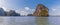 A view from a longtailed speed boat passing large limestone stacks in Phang Nga Bay in Thailand