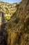 A view looking back up a narrow section of the Gaitanejo river gorge from the Caminito del Rey pathway near Ardales, Spain