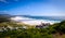 A view looking down at the beautiful white sand beach of noordhoek in the capetown area of south africa.