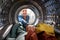 View Looking Out From Inside Washing Machine As Young Woman Does Laundry