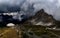 a view looking over a mountainous, rocky valley and mountain range