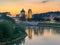 view looking up the Fiume Adige towards the St Giorgio church in Verona Italy at twilight