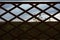 View through the lookout tower wooden security fence fence windows to the forest on a foggy autumn morning. distant horizon. spruc