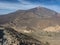 View on Los Roques de Garcia rock formation and colorful volcano Pico del Teide from from top of Alto de Guajara