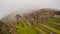 View of the Lost Incan City of Machu Picchu inside de fog, near Cusco, Peru