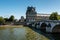 View of Louvre Palace and Pont Royal in Paris