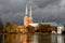 View of Lubeck Cathedral from Muhlenteich Mill pond in autumn,