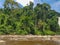 View of the Lucala river, with tropical vegetation and blue sky cloudy as background