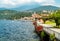 View of Luino lakefront park on the lake Maggiore in hot summer day, Italy