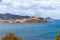 View from Magazzini Beach to the skyline of Portoferraio, and in background Padulella beach and Cap of Enfola, Elba