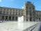 View of main courtyard of Louvre Museum in the sunny day. Paris.