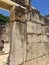 View of male tourist through doorway of ancient synagogue commemorating St. Peter in Capernaum