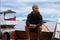 view of a man enjoying on the sailing traditional boat heading to Rangko Cave West Manggarai East Nusa Tenggara