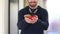 View of man hands holding fresh strawberries