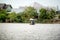 View of man in small dinghy fishing