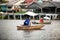 View of man in small dinghy fishing