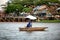 View of man in small dinghy fishing