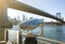 View of Manhattan bridge and New York City with a coin operated telescope binoculars viewer for tourists