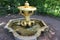 View of the Manneken Pis fountain holding a tray with a jug in the Lower Park in Petergof
