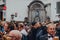 View of Manneken pis fountain sculpture in central Brussels over the crowd of people