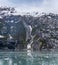 A view from the Margerie Glacier of a snow filled valley in Glacier Bay, Alaska