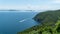 View from the Marmara island over seeing a green hill and a boat in Marmara sea, Turkey