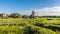 A view of the marshes and the river Glaven towards the village of Cley, Norfolk, UK