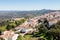 View of Marvao village with beautiful houses and church with rocky landscape mountains behind