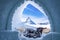 View of Matterhorn peak seen through ice igloo on snowy landscape