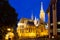 View of the Matthias Church during blue hour, roman catholic church located in Budapest, Hungary inside Fisherman`s Bastion at th