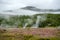 View of a Meadow with Steaming Hot Springs, Haukadalur Valley,