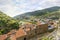 View of the Medieval Church of Saint Anthony clock tower and city and valley of Dolceacqua, Italy, from the ancient hilltop castle